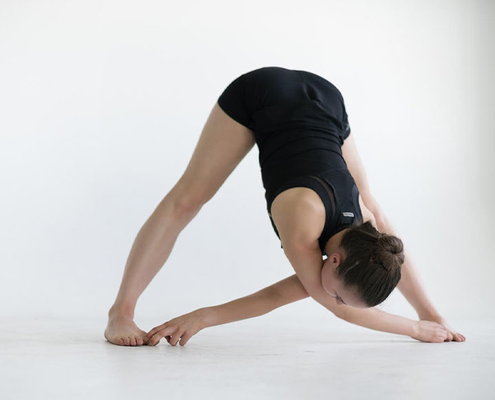 Woman performing the hamstring stretch routine
