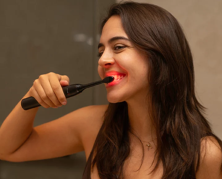 brushing with bon charge red light toohbrush
