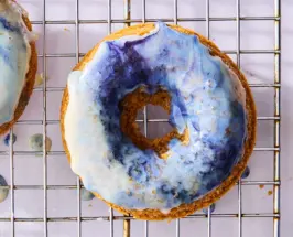 baked vanilla doughnuts with blue magic glaze