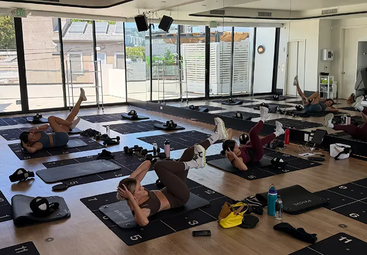 Group performing a Pvolve core workout