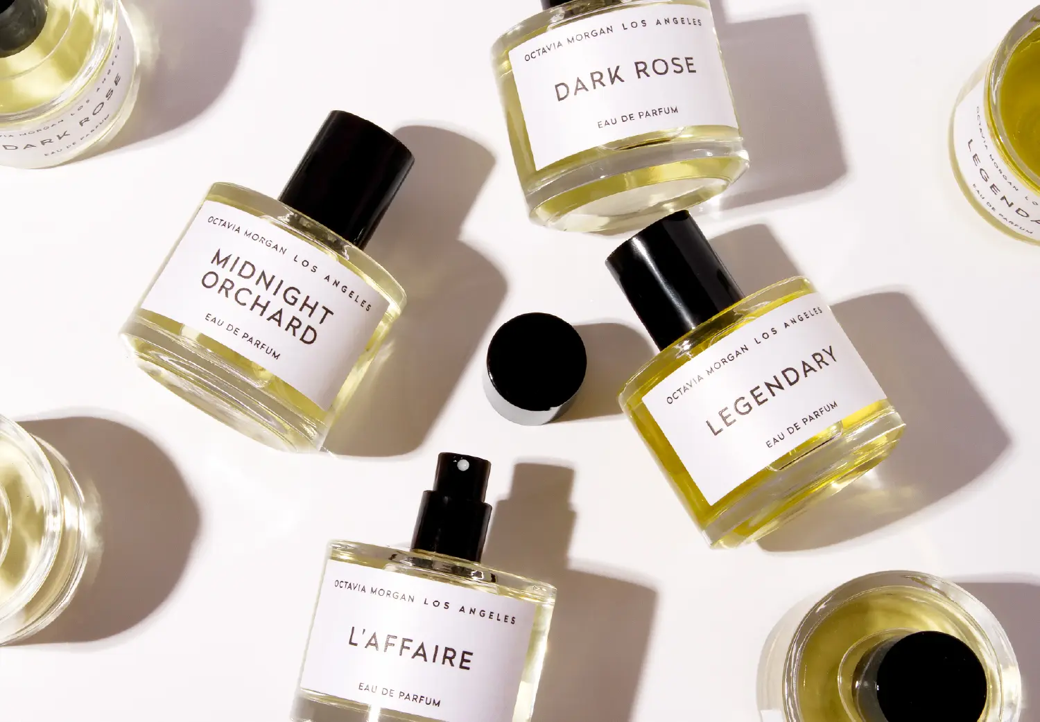 Octavia Morgan Los Angeles perfume collection featuring Midnight Orchard, Dark Rose, Legendary, and L’Affaire eau de parfum.