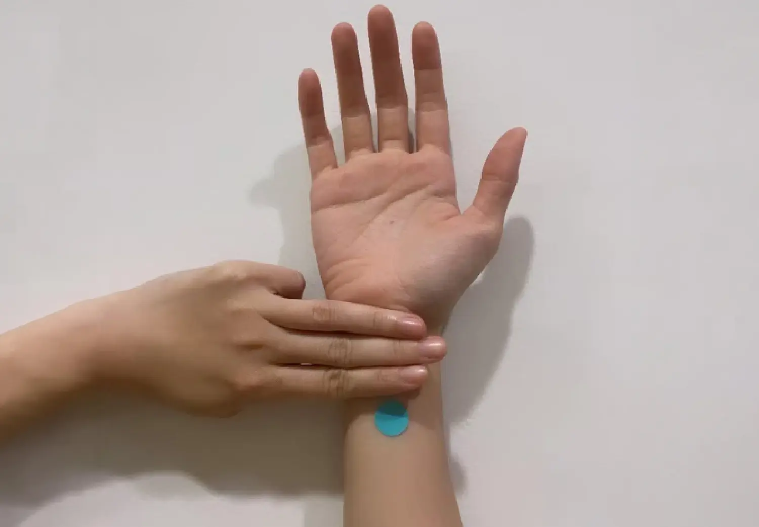 Neiguan PC6 acupressure point on the inner wrist used in a TCM relaxation practice